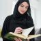 portrait-young-muslim-woman-reading-quran-modern-home-arabic-girl-reciting-holy-book-islam-to-worship-allah-ramadan-212998339